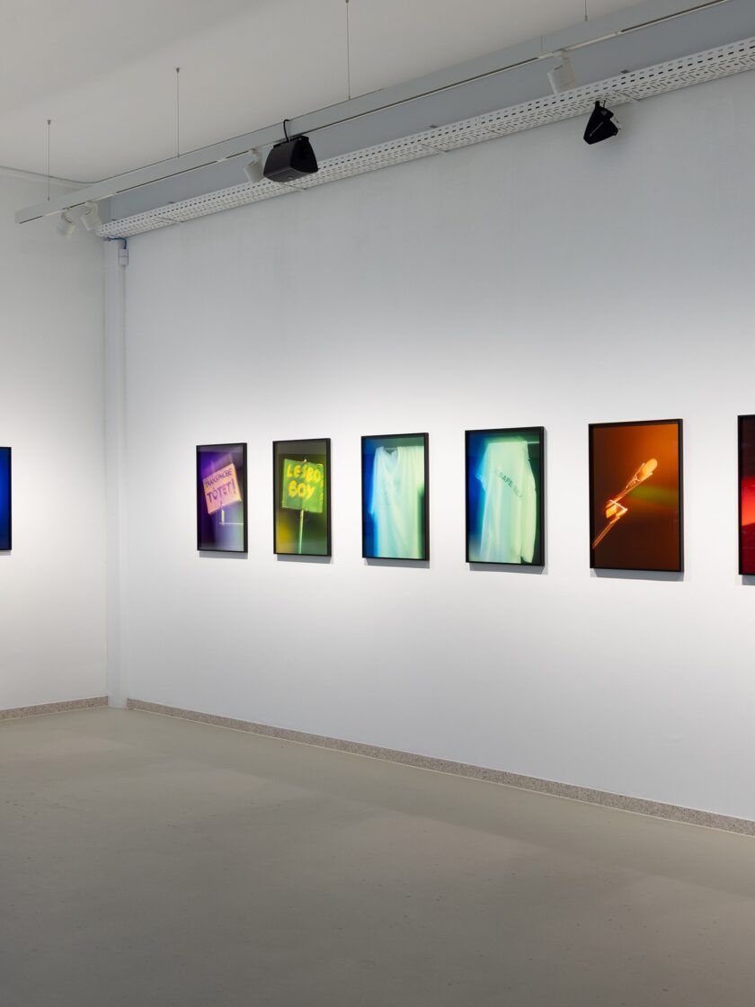 Gallery display featuring Aura by Mario Kiesenhofer, showcasing vibrant, abstract photographic artworks.
